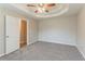Open main bedroom featuring a ceiling fan, neutral paint, and plush carpeting at 5589 Claridge Cir, Lithonia, GA 30038