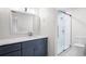 This bathroom includes a glass enclosed shower, toilet, and vanity with a marble countertop at 1307 Wynnes Ridge Se Cir, Marietta, GA 30067
