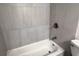 Bright and clean bathroom featuring a bathtub with gray accent tiles at 1307 Wynnes Ridge Se Cir, Marietta, GA 30067