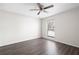 This bedroom features a ceiling fan and a bright window with wooded views at 1307 Wynnes Ridge Se Cir, Marietta, GA 30067