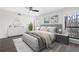 This stylish bedroom features a ceiling fan, warm grey color palette, and an abundance of natural light at 1307 Wynnes Ridge Se Cir, Marietta, GA 30067