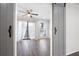 Bedroom with wood floors, ceiling fan, and natural light leads to bedroom at 1307 Wynnes Ridge Se Cir, Marietta, GA 30067