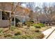 Charming multi-level townhomes with well-maintained lawns and lush landscaping on a sunny day at 1307 Wynnes Ridge Se Cir, Marietta, GA 30067