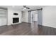 Spacious living room features hardwood floors, a fireplace, and access to a bedroom via a sliding barn door at 1307 Wynnes Ridge Se Cir, Marietta, GA 30067