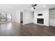 Bright living room features hardwood floors, fireplace, built-in shelves, and ceiling fan at 1307 Wynnes Ridge Se Cir, Marietta, GA 30067