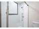 Modern walk-in shower features white subway tiles, rain shower head, and sleek glass door at 1307 Wynnes Ridge Se Cir, Marietta, GA 30067