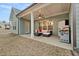 Covered back patio with ceiling fan, outdoor seating, grill, and privacy fence at 2316 Ridge View Dr, Loganville, GA 30052