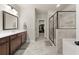 Modern bathroom with a glass-enclosed shower, vanity, and walk-in closet access at 2316 Ridge View Dr, Loganville, GA 30052