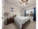 Inviting bedroom with a queen-sized bed, a window with natural light, and warm ceiling fan at 2316 Ridge View Dr, Loganville, GA 30052