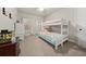 Cozy bedroom with a bunk bed, dresser, and ample natural light from the windows at 2316 Ridge View Dr, Loganville, GA 30052