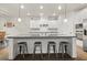 Kitchen island with barstool seating, offering a modern and social hub for cooking and gathering at 2316 Ridge View Dr, Loganville, GA 30052