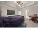 Spacious main bedroom with a tray ceiling, a large table, and neutral tones at 2316 Ridge View Dr, Loganville, GA 30052