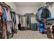 Spacious walk-in closet with custom shelving and ample storage space at 2316 Ridge View Dr, Loganville, GA 30052