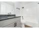 Modern bathroom featuring granite countertops, vanity, and a shower-tub combination at 347 Waits Sw Dr, Atlanta, GA 30331