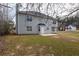 View of the home's backyard showing the lawn and patio area at 4060 Rockmill Cv, Ellenwood, GA 30294