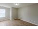 Bedroom with light-colored walls, wood-look floors, and a window at 4060 Rockmill Cv, Ellenwood, GA 30294