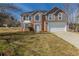 Charming two-story home features brick and siding, a well-manicured lawn and attached two-car garage at 4060 Rockmill Cv, Ellenwood, GA 30294