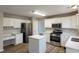 Modern kitchen featuring stainless steel appliances, an island, hardwood floors and plenty of counter space at 4060 Rockmill Cv, Ellenwood, GA 30294