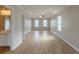 Large main bedroom with tray ceilings, a ceiling fan, and an ensuite bathroom at 4060 Rockmill Cv, Ellenwood, GA 30294