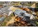 Aerial view showcasing the backyard deck adjacent to the home at 67 Blue Springs Sw Ct, Lilburn, GA 30047