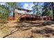 Large backyard with a wood deck, and wooden fence at 67 Blue Springs Sw Ct, Lilburn, GA 30047