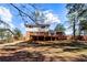 Spacious backyard with a wooden deck, perfect for entertaining or relaxing outdoors at 67 Blue Springs Sw Ct, Lilburn, GA 30047