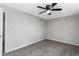 Bedroom with soft gray carpet, a ceiling fan, and neutral walls at 67 Blue Springs Sw Ct, Lilburn, GA 30047