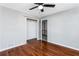 Bedroom featuring hardwood floors, ceiling fan and closet at 67 Blue Springs Sw Ct, Lilburn, GA 30047