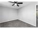 Bedroom with neutral walls, plush carpet, and ceiling fan at 67 Blue Springs Sw Ct, Lilburn, GA 30047