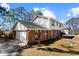Charming two-story home featuring a brick and siding exterior with a driveway at 67 Blue Springs Sw Ct, Lilburn, GA 30047