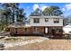 Charming two-story home with a brick facade and a welcoming front entrance at 67 Blue Springs Sw Ct, Lilburn, GA 30047