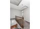 Hallway with grey carpet and white trim, plus an access ladder to the attic at 67 Blue Springs Sw Ct, Lilburn, GA 30047