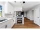 Modern kitchen featuring a stainless steel range and countertop seating area at 67 Blue Springs Sw Ct, Lilburn, GA 30047