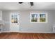 Inviting living room with hardwood floors, a window with natural light, and neutral wall paint at 67 Blue Springs Sw Ct, Lilburn, GA 30047