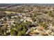 A neighborhood aerial shot shows the community and its surrounding landscape at 67 Blue Springs Sw Ct, Lilburn, GA 30047