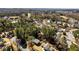 A neighborhood aerial shot shows the community and its surrounding landscape at 67 Blue Springs Sw Ct, Lilburn, GA 30047