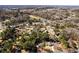 A neighborhood aerial shot shows the community and its surrounding landscape at 67 Blue Springs Sw Ct, Lilburn, GA 30047