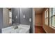 A bathroom featuring a white sink with a brushed nickel faucet and a large mirror at 1325 Classic Ne Dr, Conyers, GA 30013