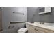 Bathroom with accessibility features including grab bars for safety and convenience at 1325 Classic Ne Dr, Conyers, GA 30013