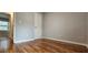 Bedroom featuring warm hardwood floors, neutral walls, closet and doorway at 1325 Classic Ne Dr, Conyers, GA 30013