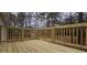 Wooden deck has railings, with a view of the home's exterior at 1325 Classic Ne Dr, Conyers, GA 30013