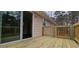 Wooden deck with sliding glass door to home and latticed railing at 1325 Classic Ne Dr, Conyers, GA 30013
