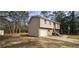 Charming split-level home with a stone foundation, attached garage and long driveway at 1325 Classic Ne Dr, Conyers, GA 30013