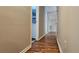 Hallway with hardwood floors connects rooms, showcasing the home's layout and design at 1325 Classic Ne Dr, Conyers, GA 30013