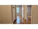 Hallway with hardwood floors that connects rooms, creating flow between spaces at 1325 Classic Ne Dr, Conyers, GA 30013