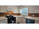Clean kitchen with white cabinets, neutral countertop, and stainless steel appliances at 1325 Classic Ne Dr, Conyers, GA 30013