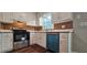 Bright kitchen with white cabinets, stainless steel appliances, and updated countertops at 1325 Classic Ne Dr, Conyers, GA 30013