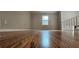 Hardwood floors and a bright window make this living room glow at 1325 Classic Ne Dr, Conyers, GA 30013