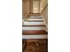 Staircase ascends to upper level featuring hardwood treads and white risers at 1325 Classic Ne Dr, Conyers, GA 30013
