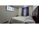 Bedroom featuring a comfortable bed, window, and wall mounted TV at 2965 Pharr Court South Nw # 316, Atlanta, GA 30305